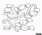 Verschiedene leckereien - Bonbons, candy-sticks und ein stück kuchen