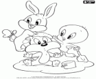 Die Baby Looney Tunes spielen in den Sand. Baby-Bugs Bunny, Baby Tweety und Sylvester Baby-